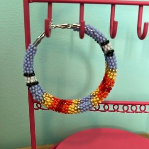 Wire wrapped beaded hoops.